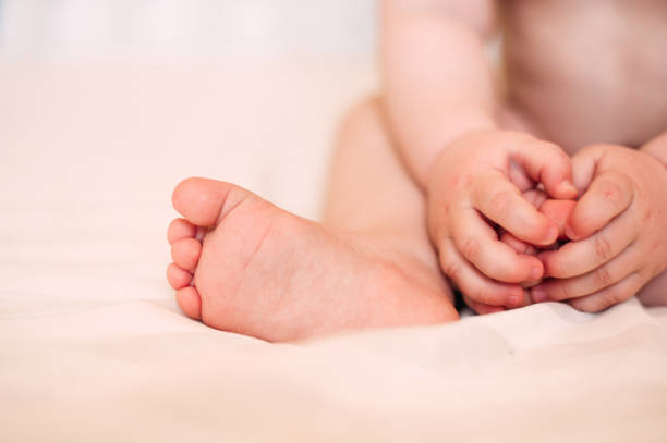 istock Baby feet. Noise and texture is added. 1200387693