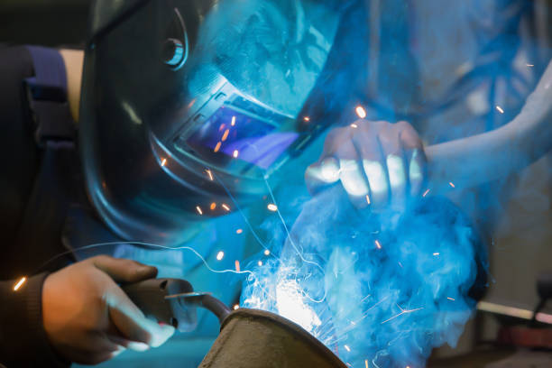 istock welder in mask welds metal 1200387923