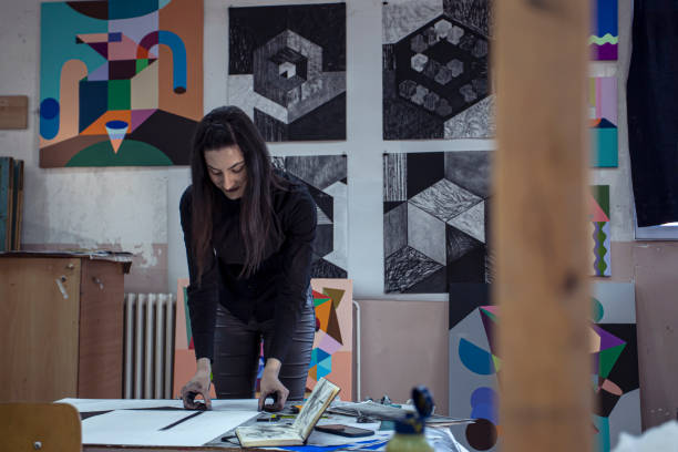 istock Professional female artist working in an art studio 1200388060