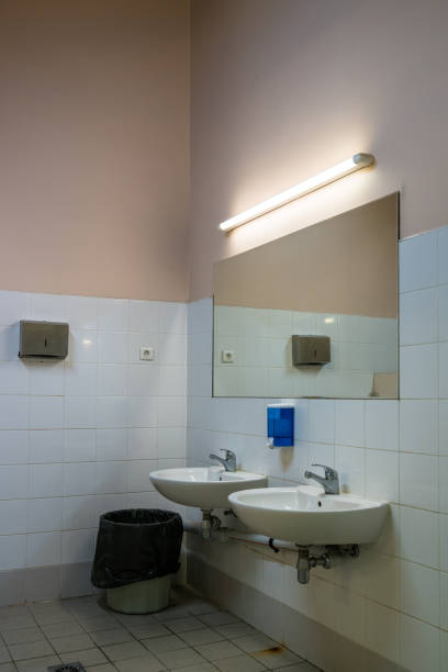 istock Sinks in a men’s locker room. 1200388801
