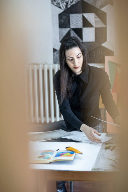 istock Young beautiful artist in the studio 1200389521