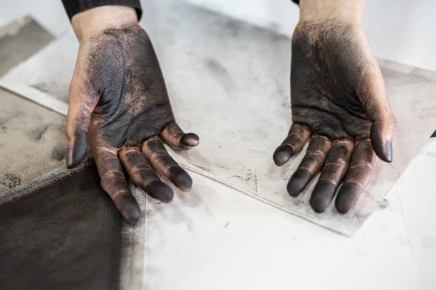 istock Femal artist with dirty hands from drawing 1200389639