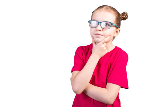 istock little girl with glasses, thought. Isolated on a white background. 1200390748