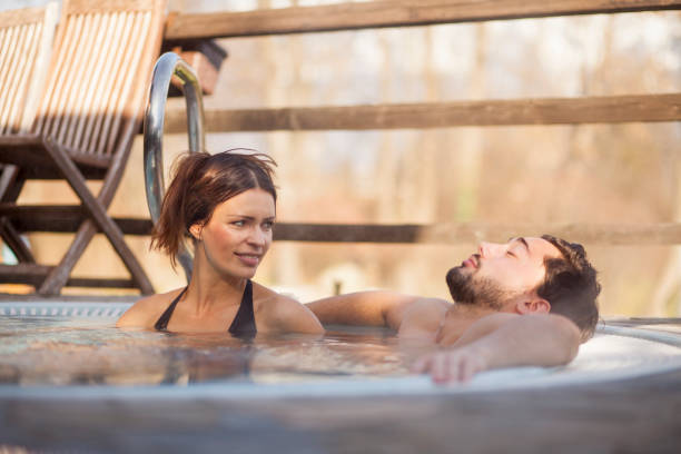 istock Couple in a hot tub 1200392979