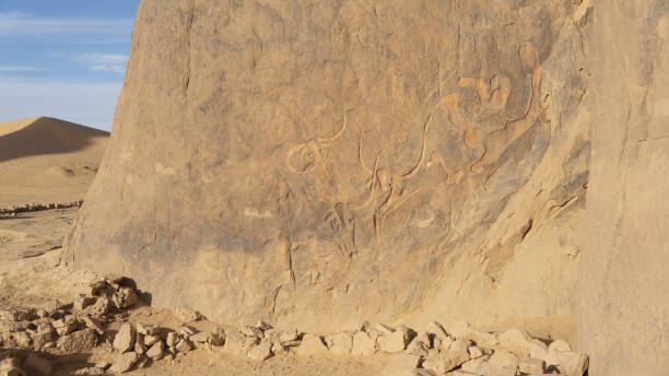 istock Ancient rock art in Sahara Desert 1200393228