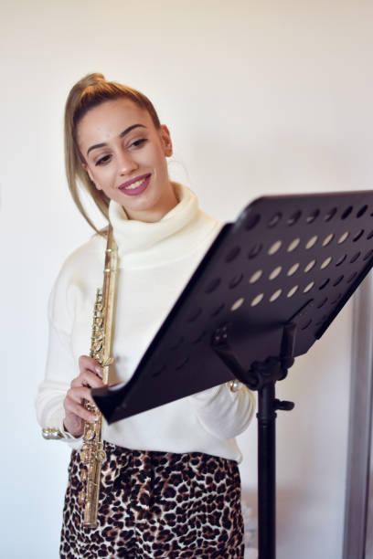 istock Woman playing flute 1200394387