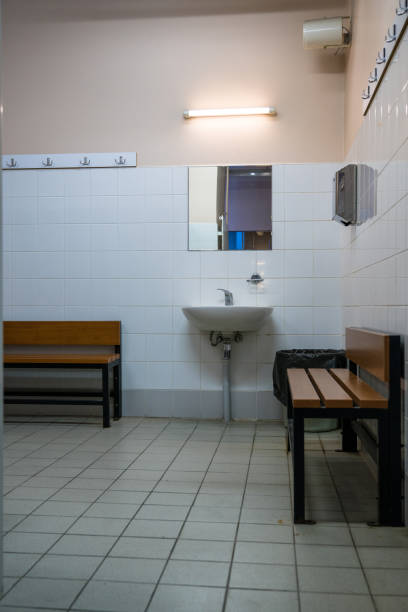 sinks in a men’s locker room. - locker room locker shower nobody imagens e fotografias de stock