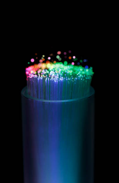 Close Up of Fiber Optic Cables Optic fiber cable with colorful blurred lights. fibre channel stock pictures, royalty-free photos & images