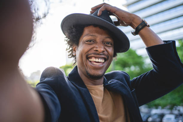 istock Cheerful hipster taking a selfie downtown 1200409237