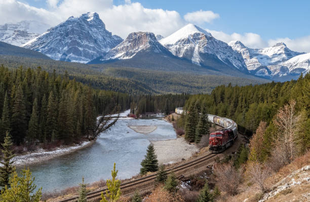 istock Train Coming Through A Valley in Banff Canada 1200415211
