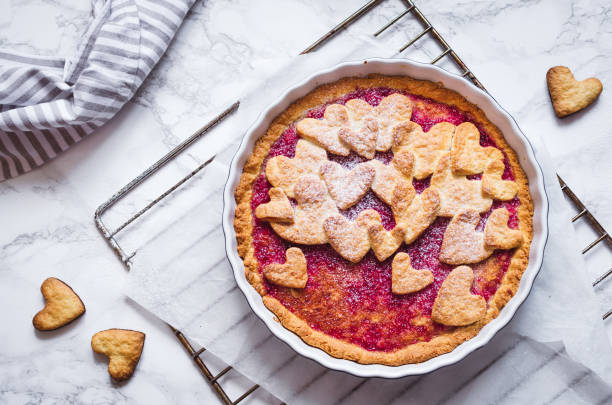 istock Raspberries jam pie with heart shape decorations 1200416101