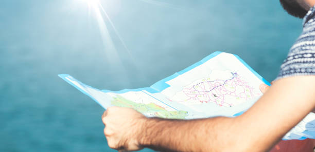 istock Tourist man holding a Map at outdoor 1200419922