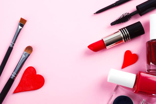 istock Decorative cosmetics and makeup brushes on pink background. Top view, copy space 1200423424