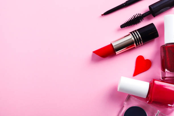 istock Decorative cosmetics and makeup brushes on pink background. Top view, copy space 1200423472