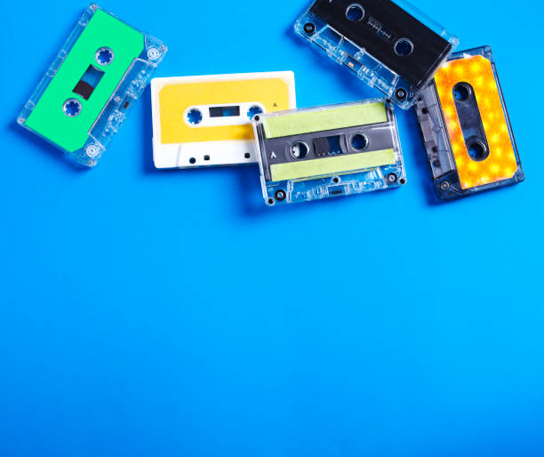 istock Retro cassette tapes on blue background, top view, copy space 1200427344