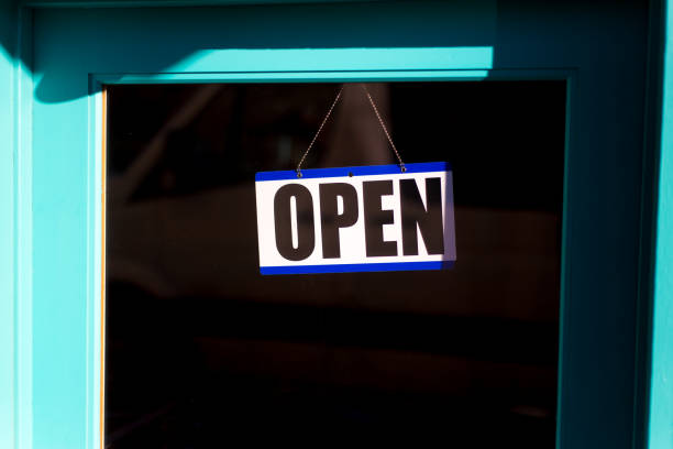 istock Open Sign on Turquoise Door, Black Background, Copy Space 1200429460
