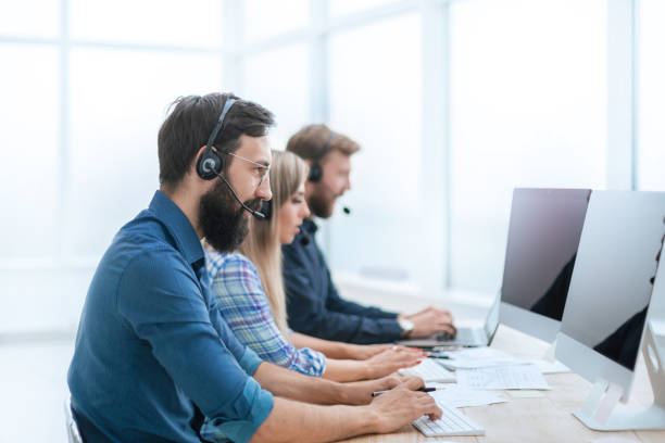 istock call center employees work on PC in the office 1200430229