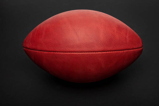 istock Football shot in studio on black background 1200431213