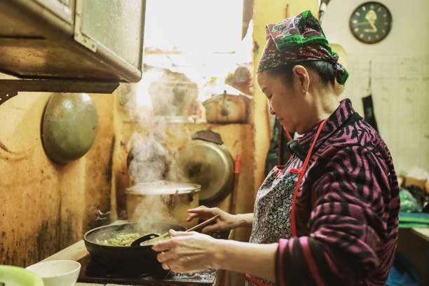 istock Asian senior woman is cooking 1200433340