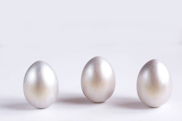 istock Easter holiday composition. Three eggs of silver color on a white background. Easter flat ley. Easter concept. Copyspace. 1200436182
