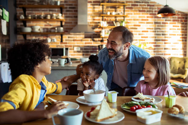 istock Single father having breakfast with his kids 1200438648