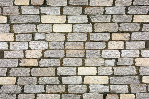 granite pavement texture. Stone cobblestoned pavement background