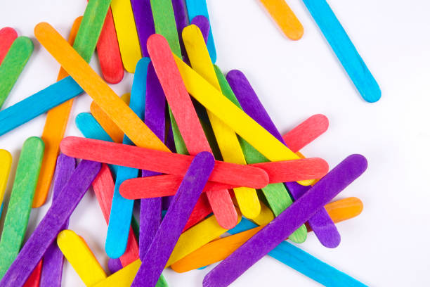 istock Colourful wooden sticks on white background 1200448133