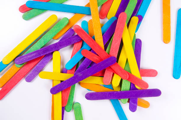 istock Colourful wooden sticks on white background 1200448135
