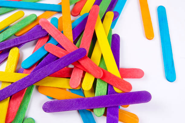 istock Colourful wooden sticks on white background 1200448136