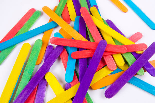 istock Colourful wooden sticks on white background 1200448139