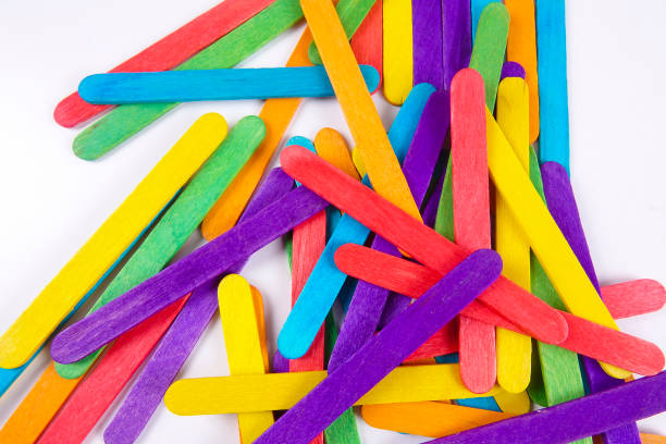 istock Colourful wooden sticks on white background 1200448143