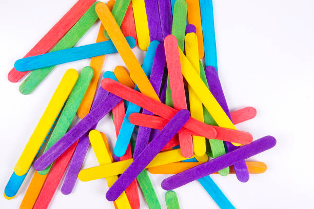 istock Colourful wooden sticks on white background 1200448145