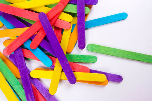 istock Colourful wooden sticks on white background 1200448146