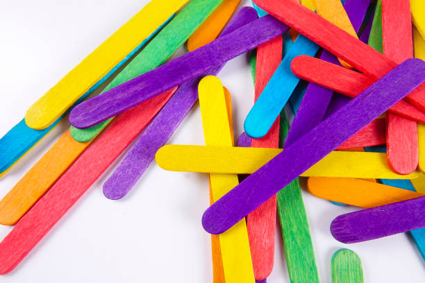 istock Colourful wooden sticks on white background 1200448147
