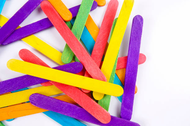 istock Colourful wooden sticks on white background 1200448151