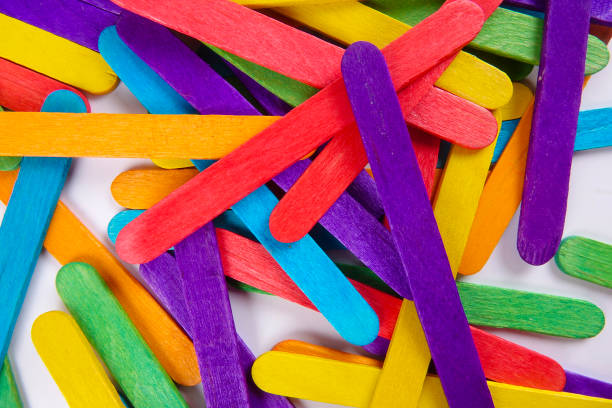 istock Colourful wooden sticks on white background 1200448152
