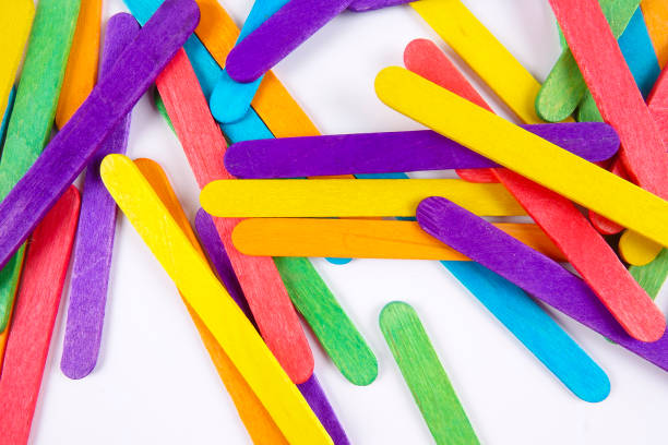 istock Colourful wooden sticks on white background 1200448153