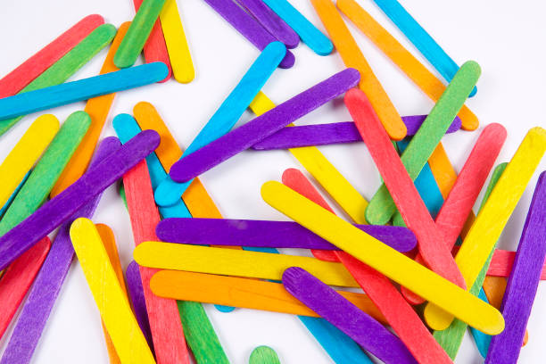 istock Colourful wooden sticks on white background 1200448154