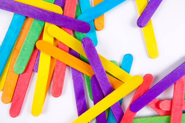 istock Colourful wooden sticks on white background 1200448157