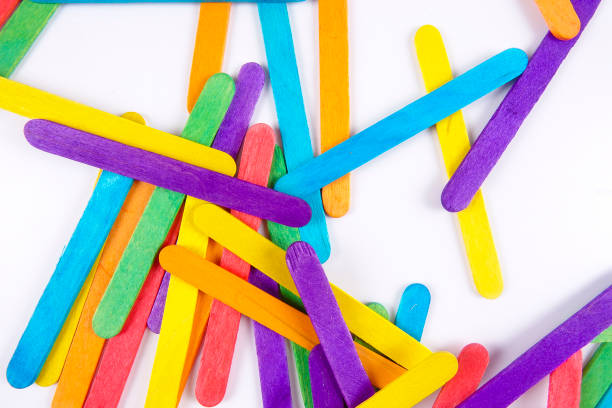 istock Colourful wooden sticks on white background 1200448164