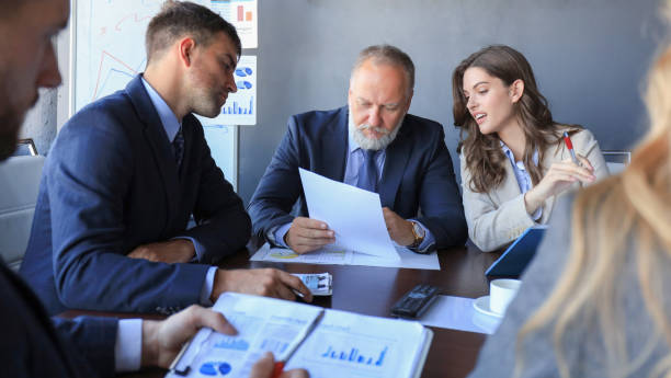 istock Business people working on new project at modern office. 1200450493