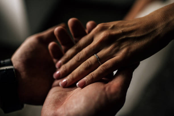 Close up on hands joined in wedding