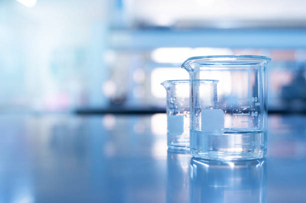 istock glass beaker with water in education chemistry blue science laboratory 1200451933