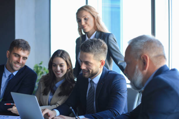 istock Group of business partners discussing ideas and planning work in office. 1200451962