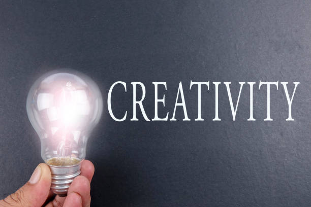 istock Idea concept word IDEA. Light of bulb on grey background. Low light 1200453157