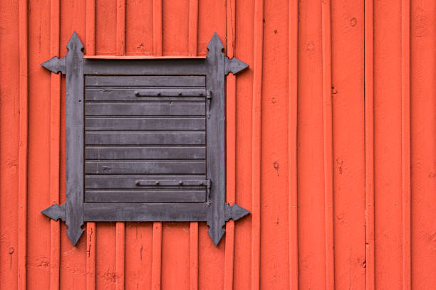 typical red painted wood in scandinavia, house with closed window. - falun imagens e fotografias de stock
