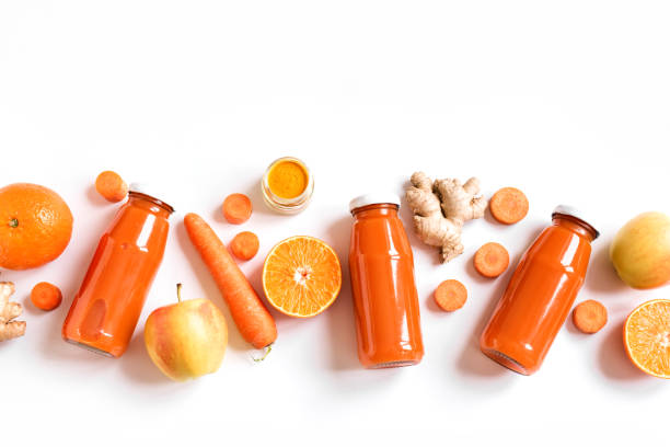 detox cleanse getränk - carrot isolated white carotene stock-fotos und bilder