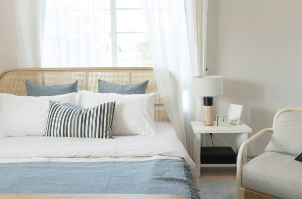 istock Bedroom interior with wood headboard and side table lamp. 1200459613