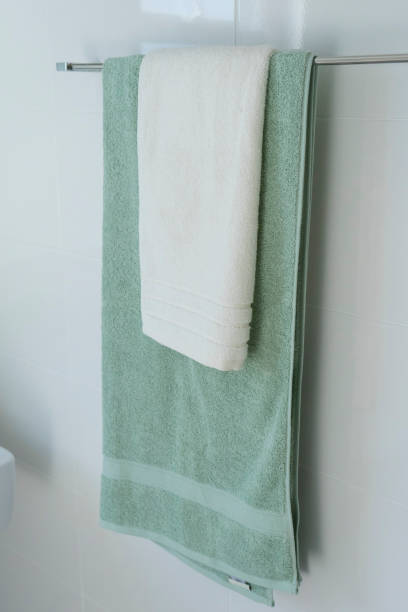 istock Green towel hanging in bathroom 1200461207