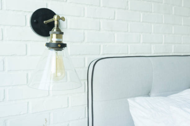 istock Modern white bedroom with classic lamp 1200461958